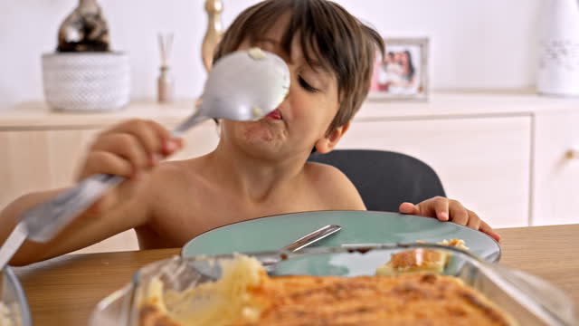 Child’s Play - Little One Serves Himself With Big Spoon From Glass Dish, Then Licks The Spoon And Puts It Back On The Tray