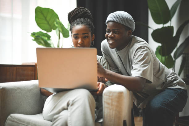 istock Man and woman using laptop 2131253011