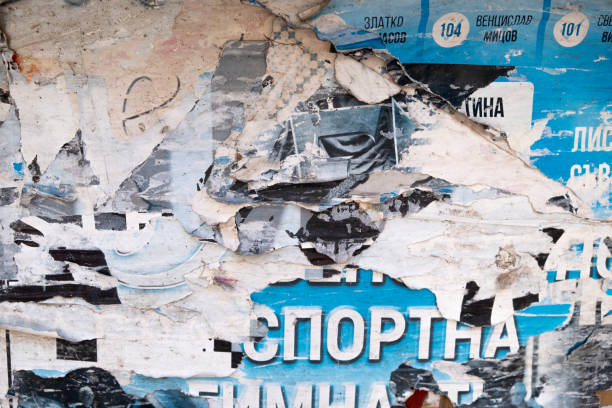 Torn and peeled street poster background, weathered old paper backdrop