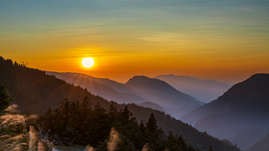 A captivating sunrise scene in late winter at the observation deck of National Taipingshan Forest Recreation Area, Ilan county, northeastern Taiwan.