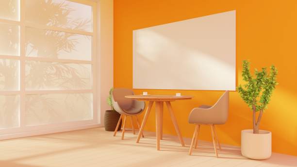 istock A cozy coffee table with armchairs in a bright home interior, flooded with sunlight from the window. Shadows from tree branches dance on the wall 2131355049