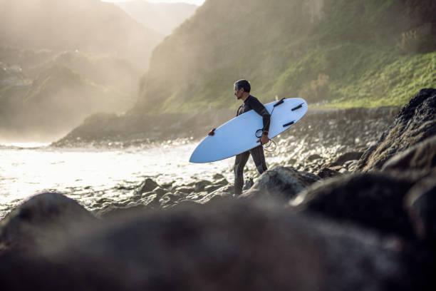istock Surfing at sunset. Become your higher self. 2131376211
