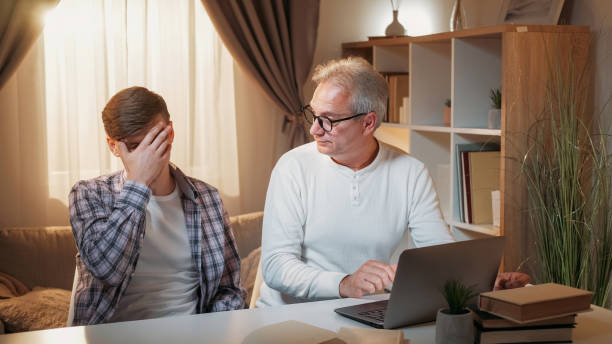 istock Two generations family quarrel laptop problem 2131376770