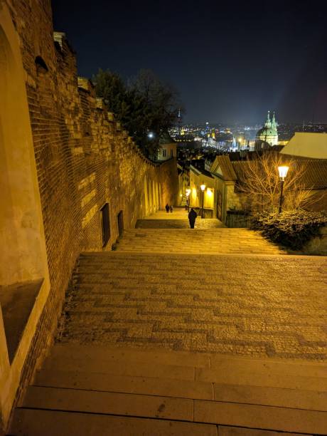istock People going down stairs at night under street lights 2131388188