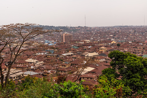 Skyline images of the city of Ibadan in Nigeria  from the top of Oke Are, showing the brown currugated roofs  of the city.