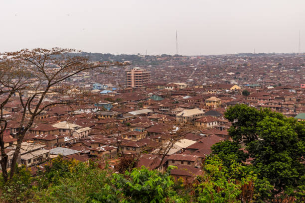 View of Ibadan city from Oke Are Skyline images of the city of Ibadan in Nigeria from the top of Oke Are, showing the brown currugated roofs of the city. ibadan stock pictures, royalty-free photos & images