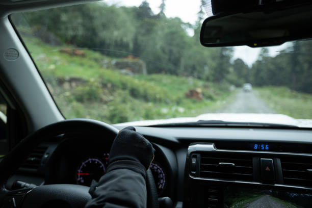 istock Driving car in the forest mountain trail, China 2131492942