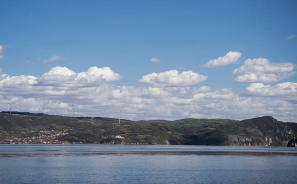 istock Wind turbines on the hill on a beautiful day with clouds 2131500635