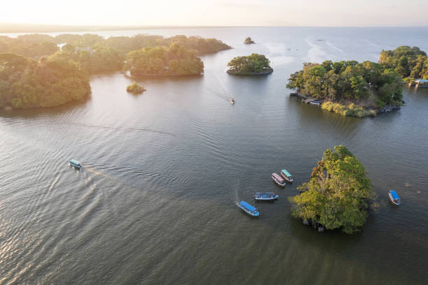 istock Boats next to small island 2131582842