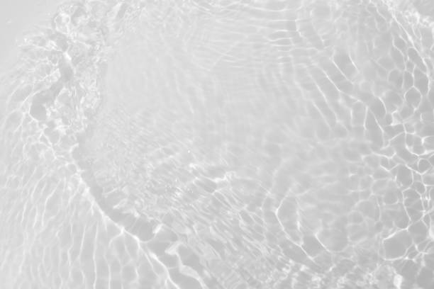 istock White water surface texture with ripples, splashes, and bubbles. Abstract summer banner background Water waves in sunlight with copy space cosmetic moisturizer micellar toner emulsion. White water. 2131634588