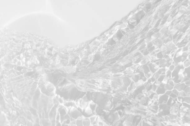istock White water surface texture with ripples, splashes, and bubbles. Abstract summer banner background Water waves in sunlight with copy space cosmetic moisturizer micellar toner emulsion. White water. 2131634589
