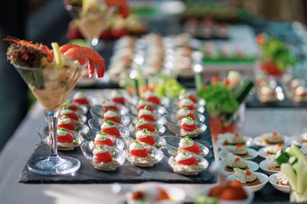 istock Various sweet desserts, appetizers, and finger foods are arranged on a buffet table, ready for party guests to enjoy. 2131663649