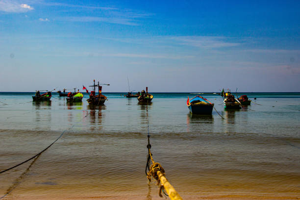 istock Fishing boats on the mirror-smooth water 2131706435