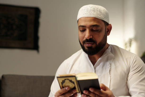 istock Bearded Muslim Reading Quran Book 2131762489