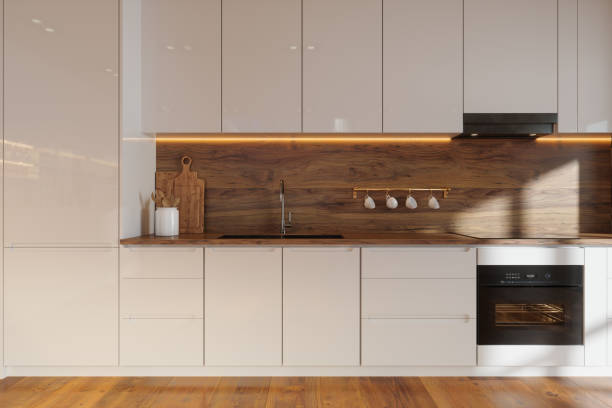 istock Modern Kitchen Interior With White Cabinets, Wooden Kitchen Counter, Kitchen Utensils And Parquet Floor 2131773929