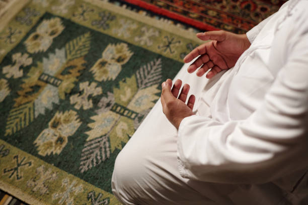 istock Unrecognizable Muslim Man Praying Salat 2131795100