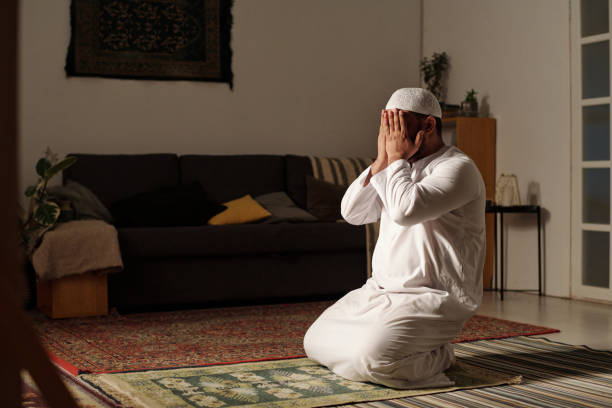 istock Unrecognizable Muslim Man Praying Salah At Home 2131795150