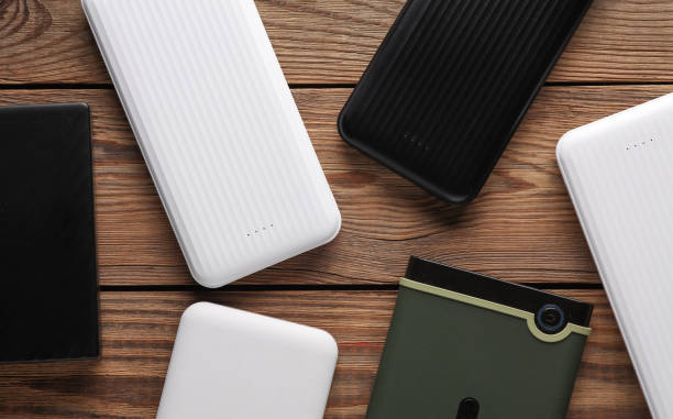 istock Power banks and external hard drives on wooden table 2131795267