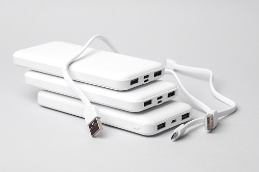 White power banks on a gray background. External battery