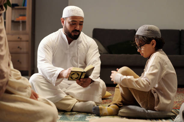 istock Man Explaining Quran Surah At Family Gathering 2131797815