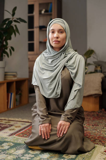 istock Muslim Woman Sitting On Floor 2131802737