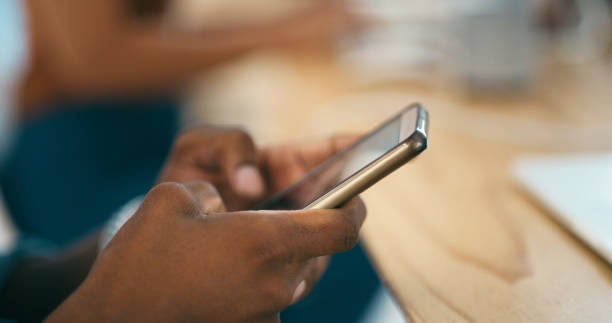 istock Hands, phone and typing a message or texting, communication and networking in coworking office. Closeup, businessperson and networking or b2b on app for chatting, website and online research for info 2131859148