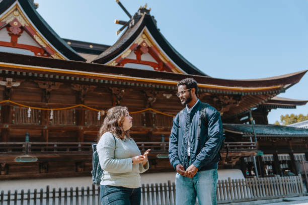 istock Two tourists visiting a shrine in Japan while on vacation 2131863457