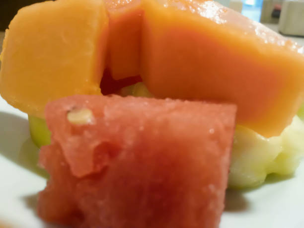 istock pieces of papaya and melon on a plate 2131878558