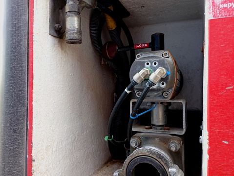 A pneumatic installation in a fire truck to shut off the water supply. Mechanical water shut-off handle in the closed position.