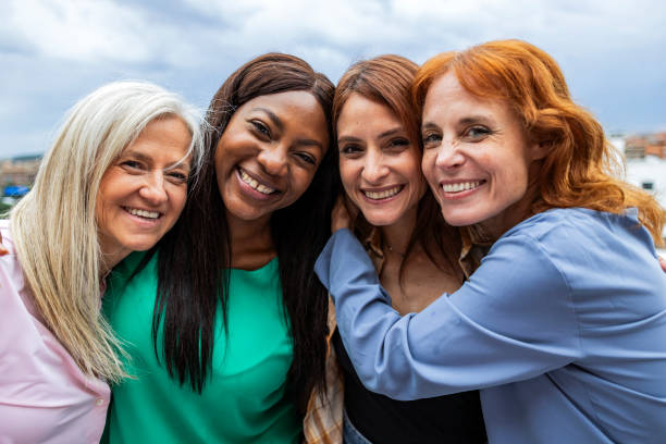 istock Close Friends Sharing a Joyful Embrace Outdoors 2131925300