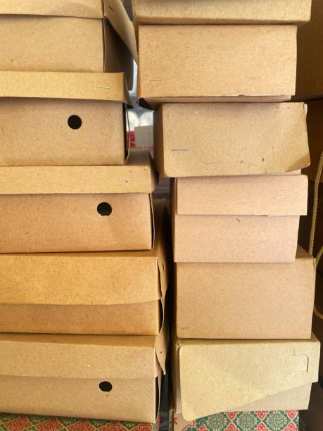 istock a pile of assorted brown cardboard boxes with blurred tar on the back 2131928950