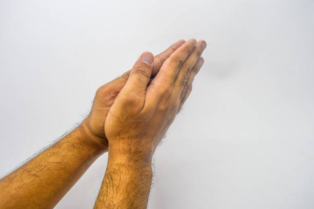 a hand gesture of apologizing or shaking hands or greetings