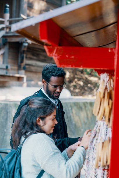 istock Two tourists visiting a shrine in Japan while on vacation 2131955331