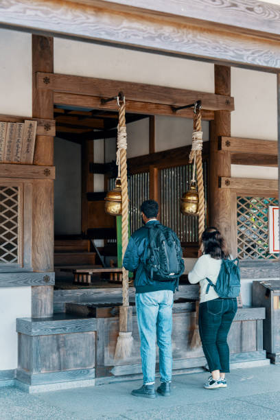 istock Two tourists visiting a shrine in Japan while on vacation 2131955332