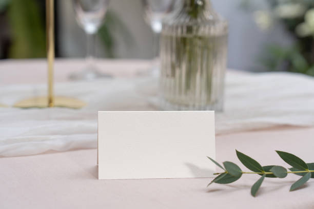 istock Mockup white blank space card, for Name place, Folded, greeting, invitation on wedding table setting background. 2131962191