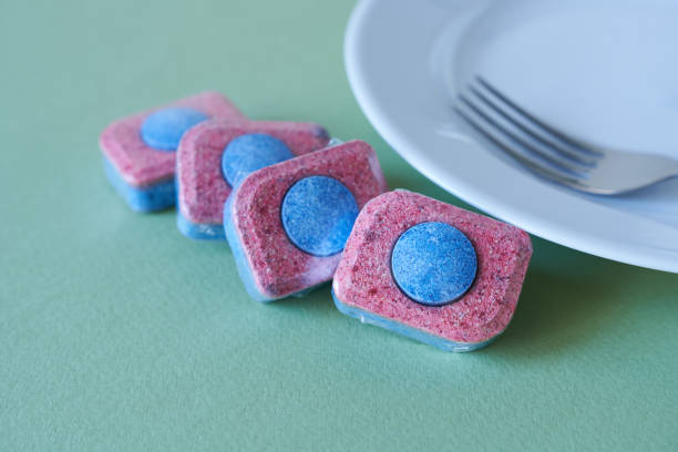 istock Dishwasher tablets and clean dishes. Detergent for dishwashers. 2131963252