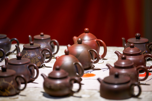 Close-up of exquisite and elegant Chinese purple sand ceramic tea cups and teapots