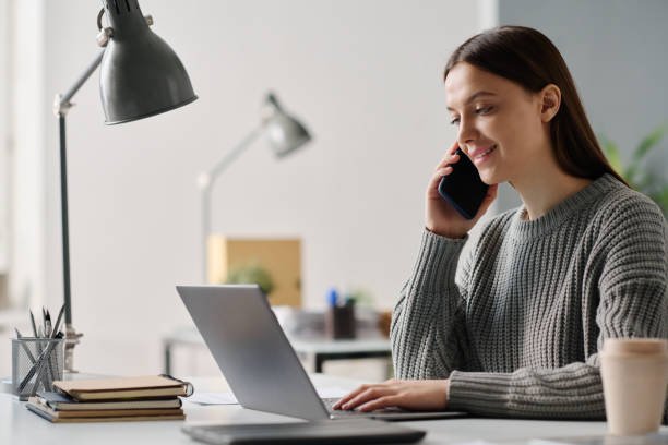 istock Young Manager Talking On Phone At Work In Office 2131992480