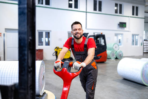 istock Working in paper making factory transporting rolls with forklift. 2132008980