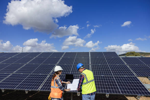 istock Maintenance engineer team working in wind turbine farm at sunset 2132013755