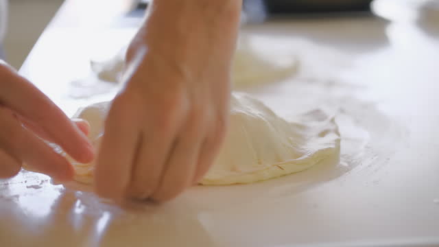 Cooking calzone,  a lady preparing a traditional Italian dessert