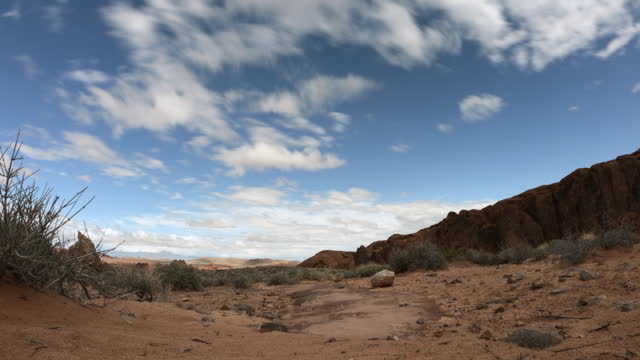 Clouds form during a timelapse over the desert rocks of Nevada.