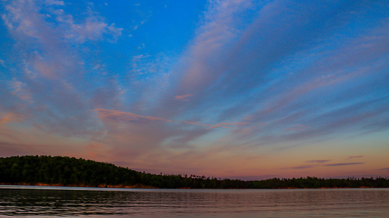 Lines of clouds fill these post sunset skies on beautiful Lake Sinclair in Milledgeville, Georgia.