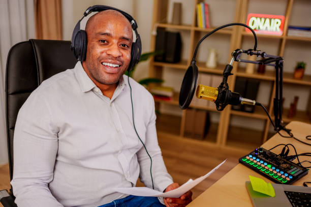 istock mid adult man hosting live show 2132038680