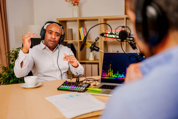 istock Two mid adult men recording a podcast 2132042970