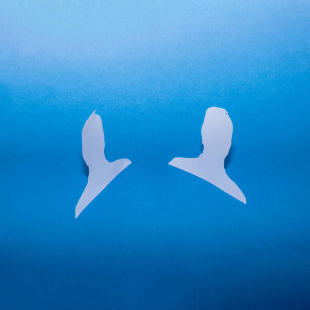Head shape from paper on a blue background. Business team concept. Facebook creative concept. Copy space creative.