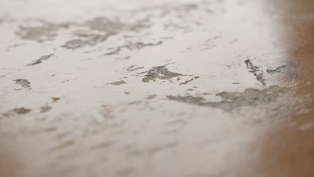 Close-up of a worn wooden surface with detailed textures and patterns