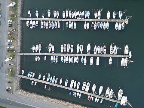 An aerial top view of moored boats on the harbor of Assens
