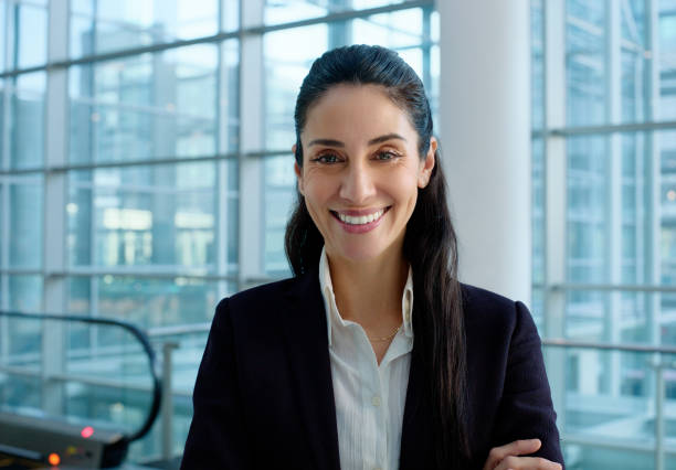 istock Woman, portrait and smile with workspace, confidence and work for professional startup financial advisor. Employee, consultant and entrepreneur with corporate, office and happiness at law firm 2132147067