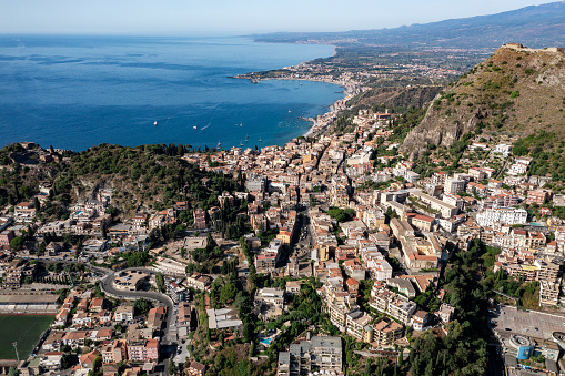 Sunny view of the hilltop town of Taormina on the island of Sicily